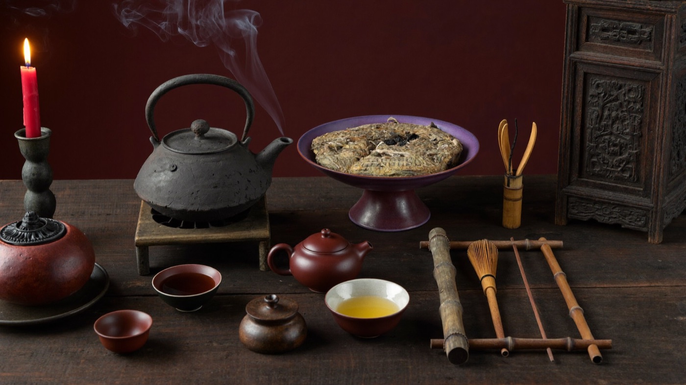 Traditional tea implements over charcoal